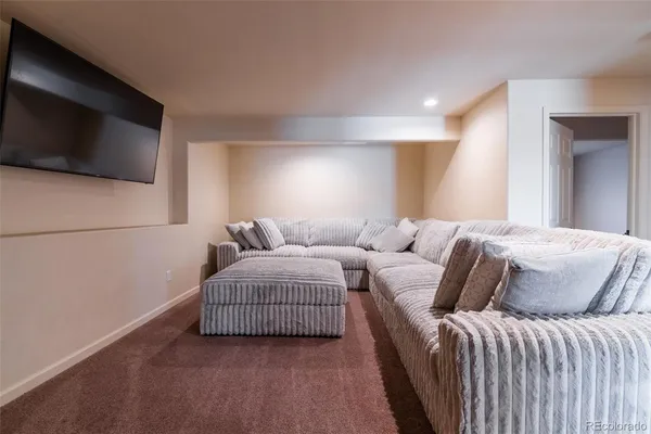 a living room with a couch and a flat screen tv
