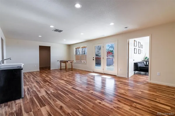 a view of a livingroom with wooden floor