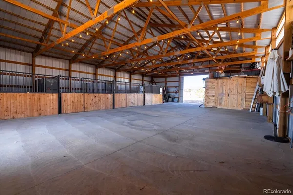 a view of an empty room with wooden walls