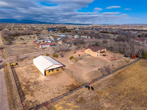 an aerial view of residential houses with outdoor space