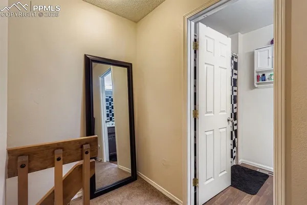 a bedroom with a bed and flat screen tv