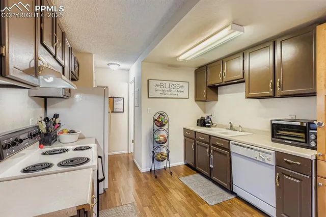 a kitchen with stainless steel appliances granite countertop a stove and a sink