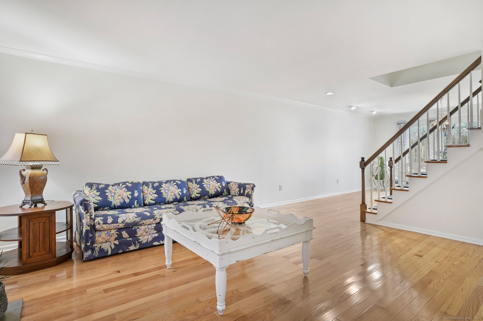 120 Prospect Street, Unit 48 Ridgefield, CT 06877 - Photo 13 of 38 a living room with furniture and a wooden floor