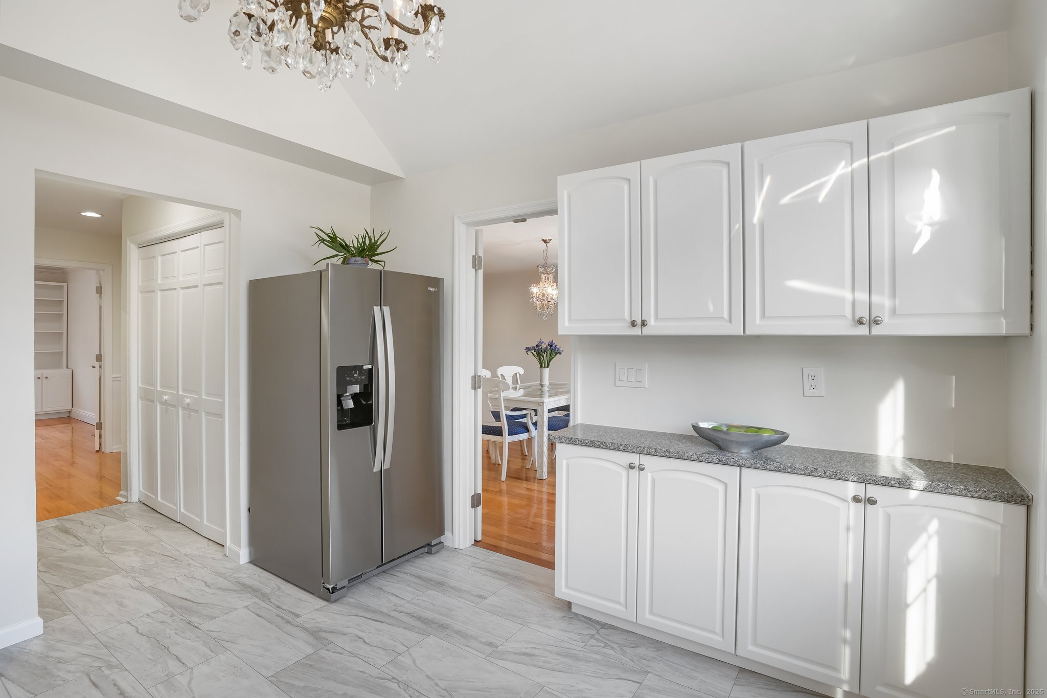 120 Prospect Street, Unit 48 Ridgefield, CT 06877 - Photo 18 of 38 a kitchen with stainless steel appliances granite countertop a refrigerator and a stove top oven