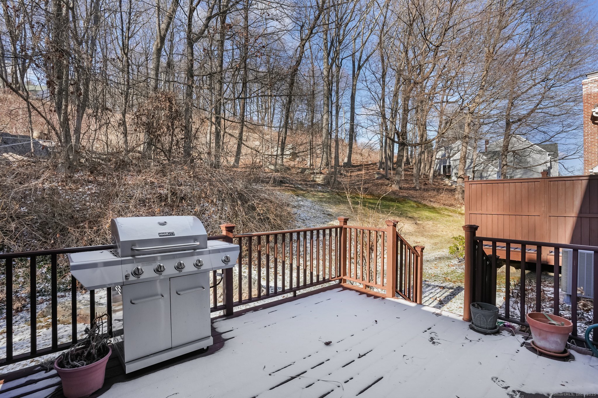 120 Prospect Street, Unit 48 Ridgefield, CT 06877 - Photo 2 of 38 a view of a chairs and table in the back yard