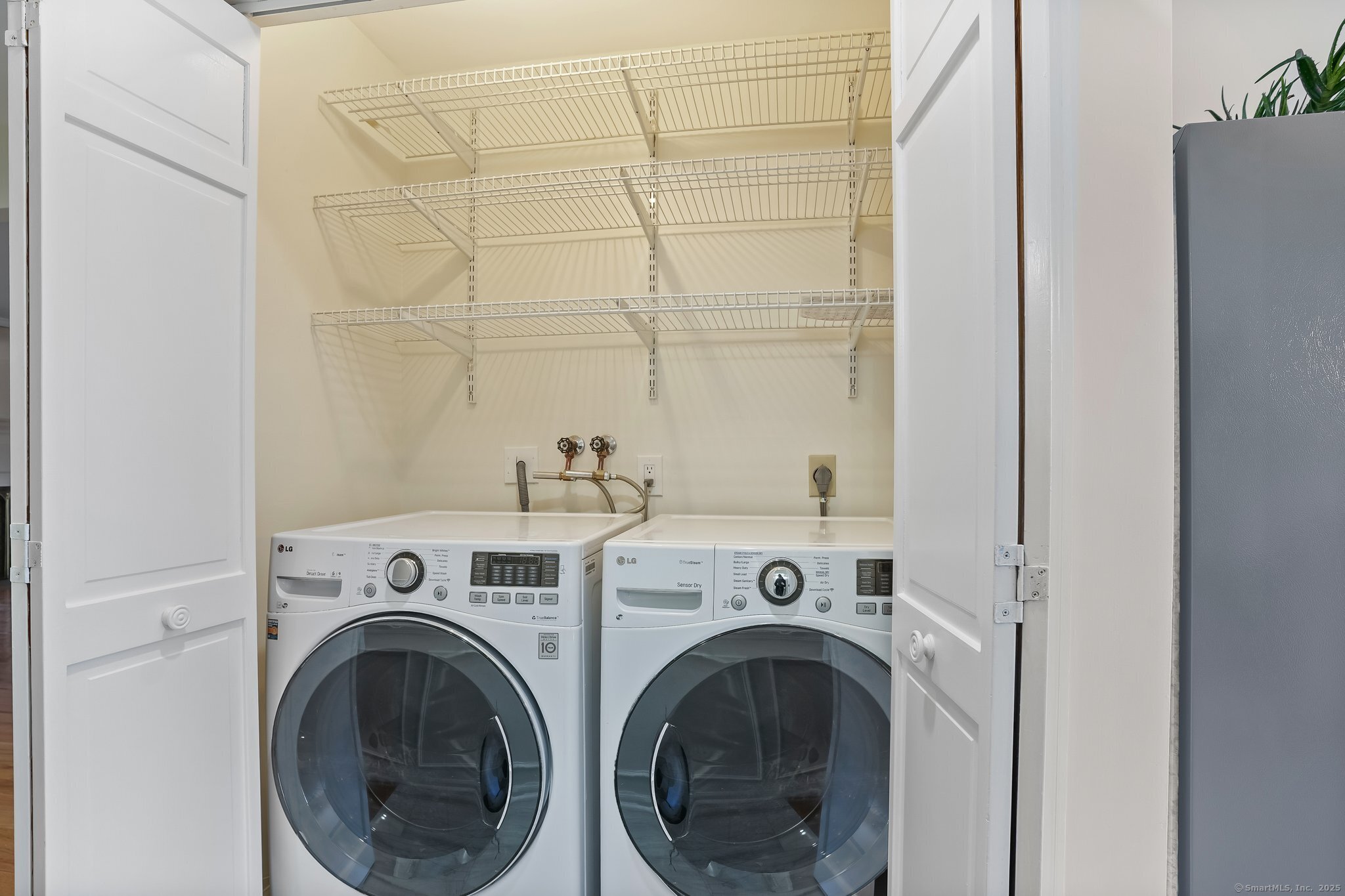 120 Prospect Street, Unit 48 Ridgefield, CT 06877 - Photo 21 of 38 a view of washer and dryer in a utility room