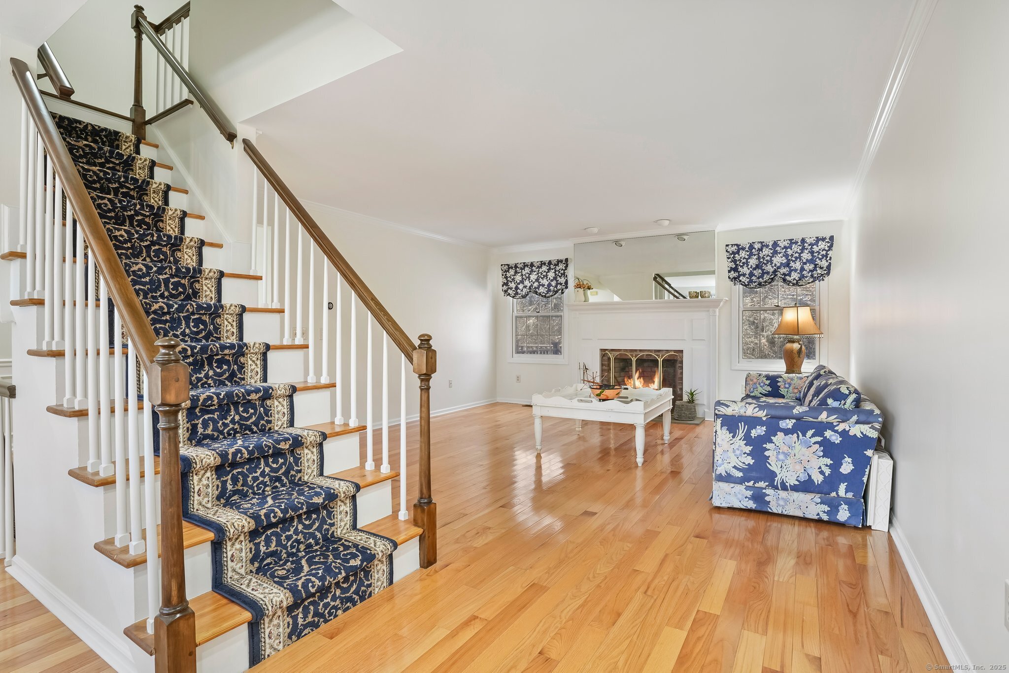 120 Prospect Street, Unit 48 Ridgefield, CT 06877 - Photo 28 of 38 a living room with furniture and a wooden floor