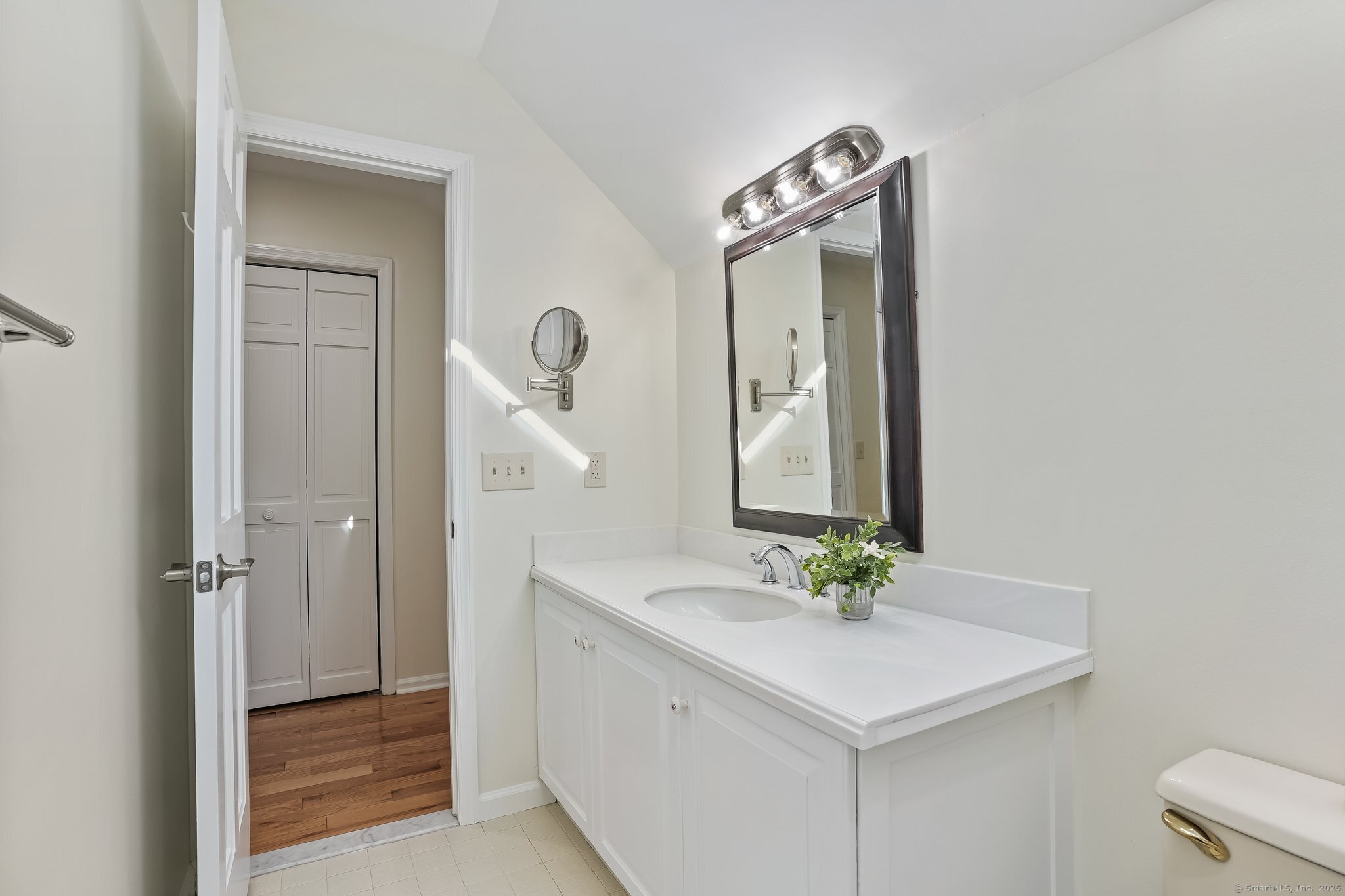 120 Prospect Street, Unit 48 Ridgefield, CT 06877 - Photo 31 of 38 a bathroom with a sink a mirror and a shower