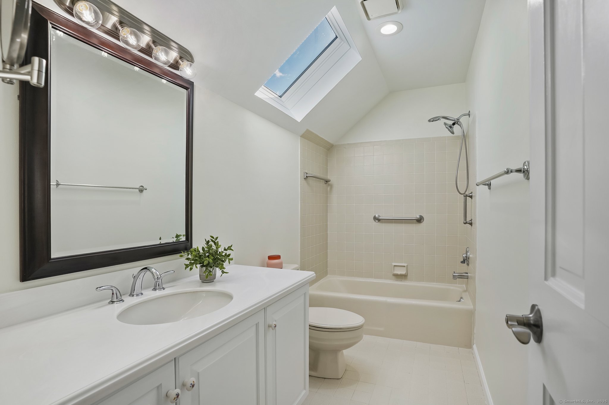 120 Prospect Street, Unit 48 Ridgefield, CT 06877 - Photo 32 of 38 a bathroom with a granite countertop sink a toilet and shower