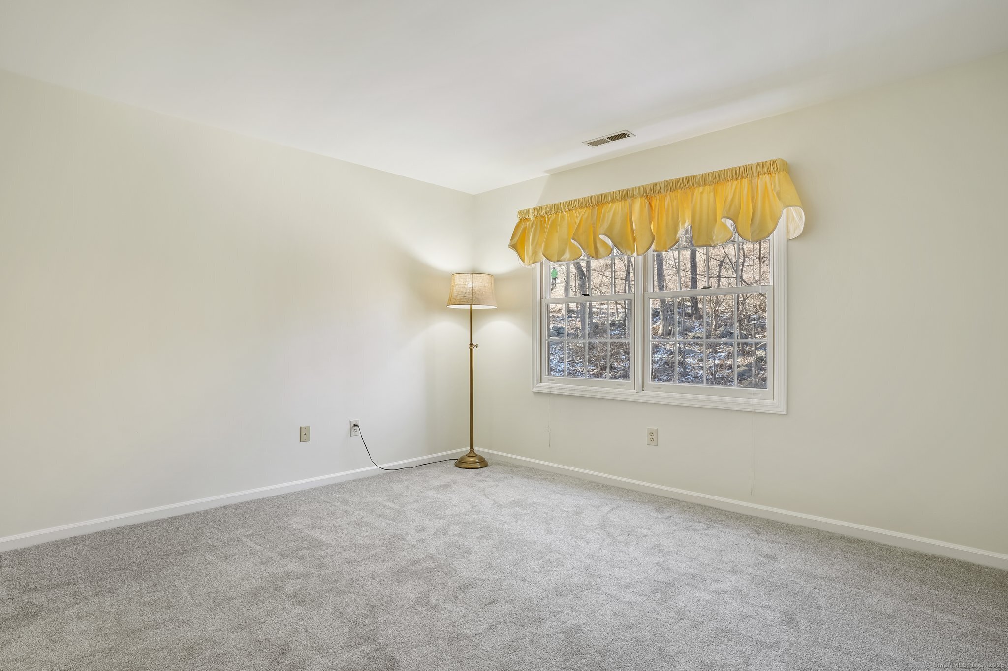 120 Prospect Street, Unit 48 Ridgefield, CT 06877 - Photo 34 of 38 an empty room with a window