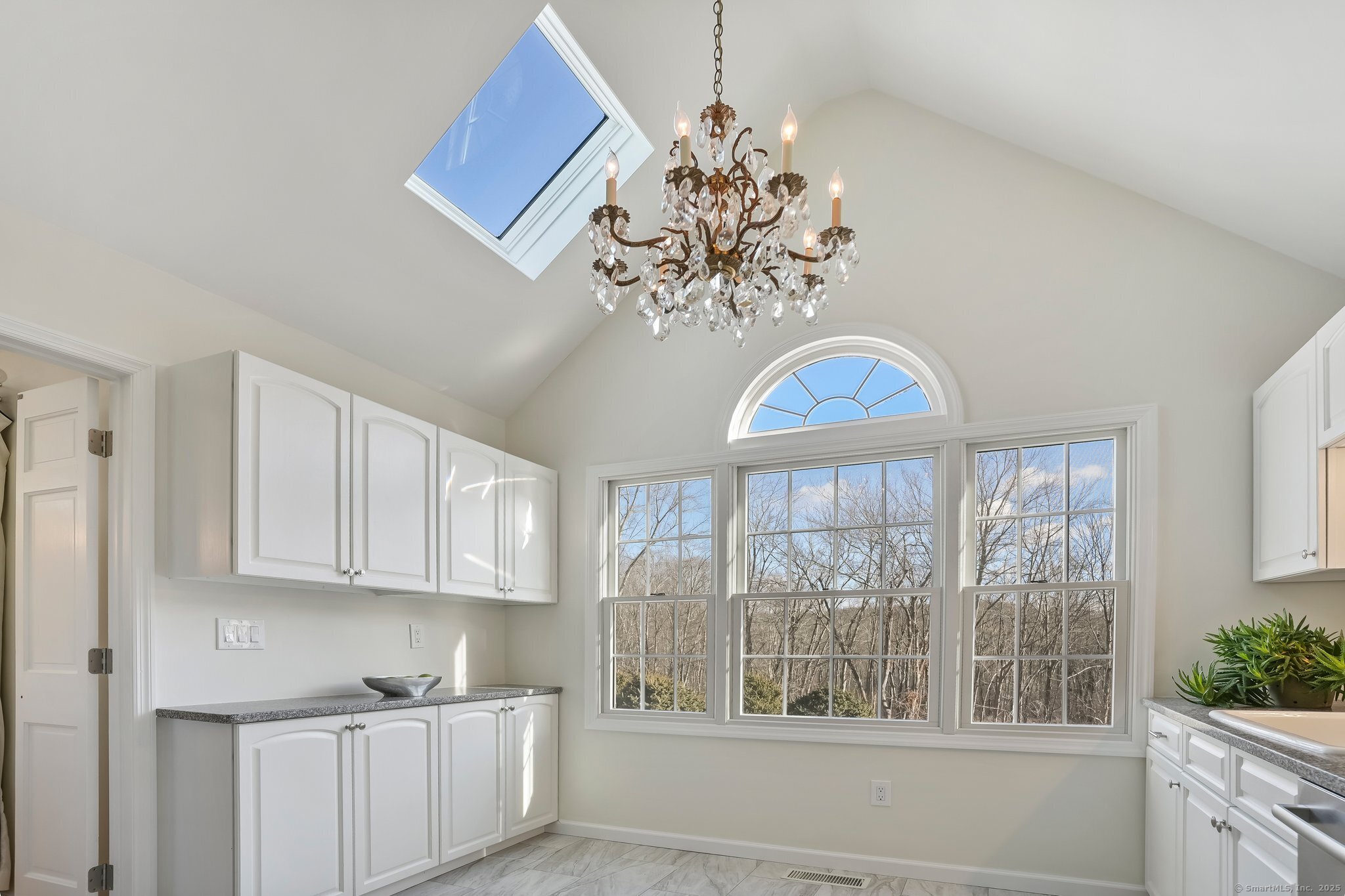 120 Prospect Street, Unit 48 Ridgefield, CT 06877 - Photo 5 of 38 a view of a kitchen with granite countertop a window