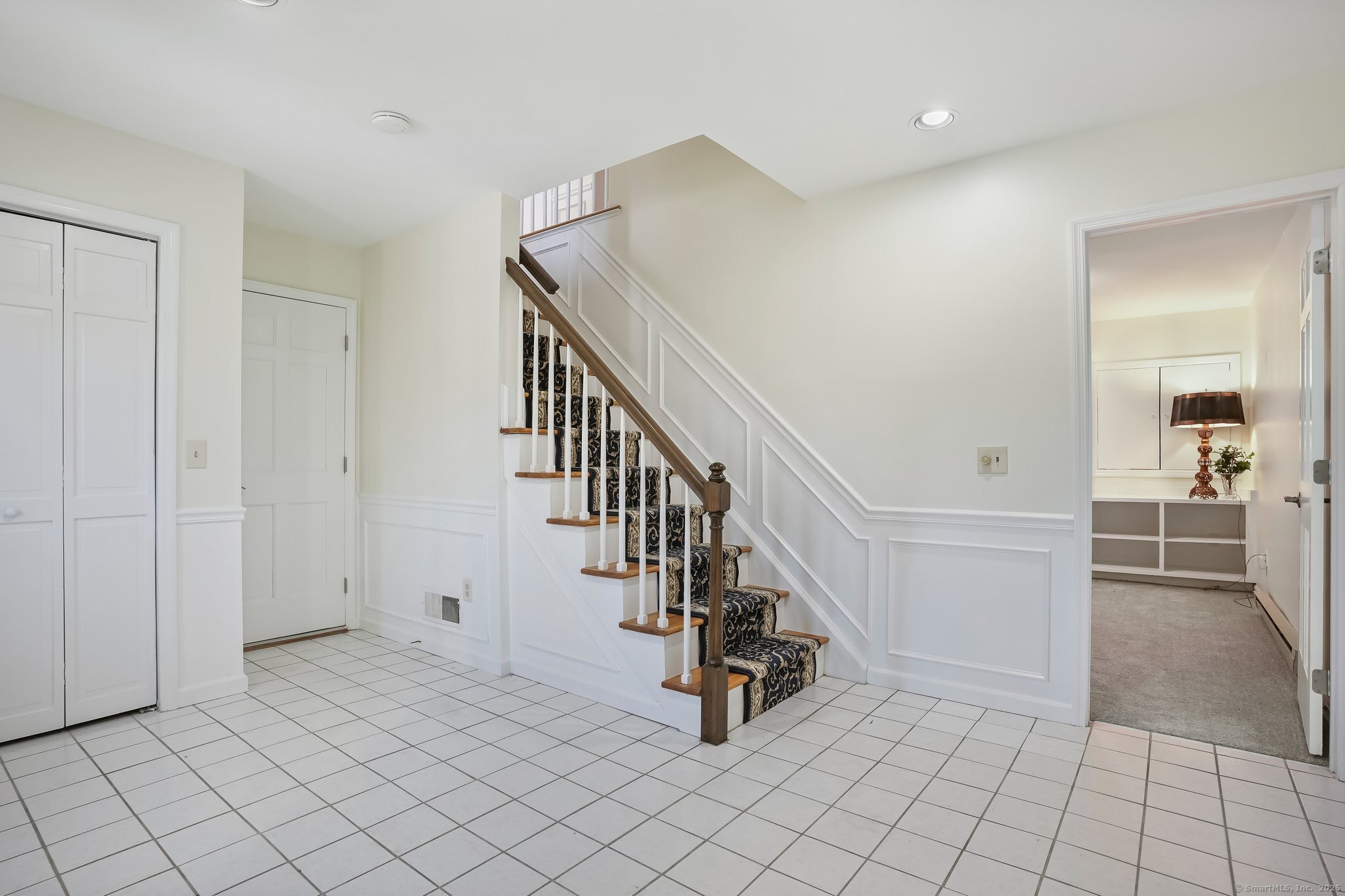 120 Prospect Street, Unit 48 Ridgefield, CT 06877 - Photo 8 of 38 a view of an entryway and stairs