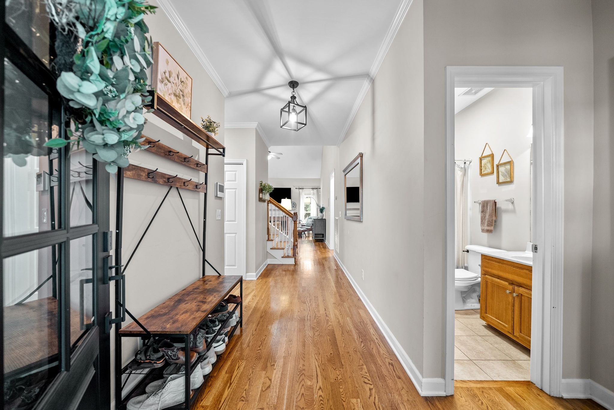 1161 Cynthia Lane Spring Hill, TN 37174 - Photo 3 of 42 a view of a hallway with wooden floor and staircase