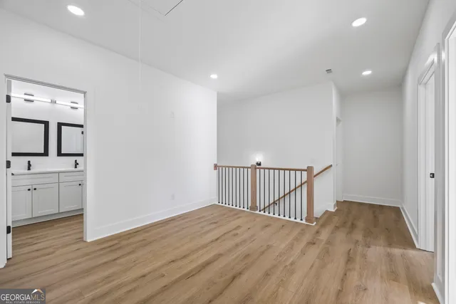 a bathroom with double sink and a mirror