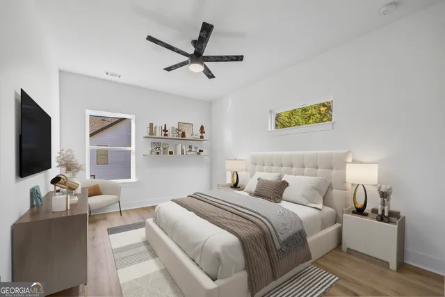 a view of a house with backyard and trees