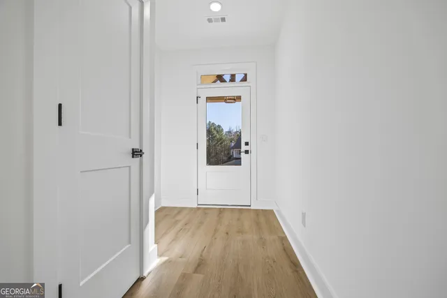 a kitchen with a stove a refrigerator and a sink
