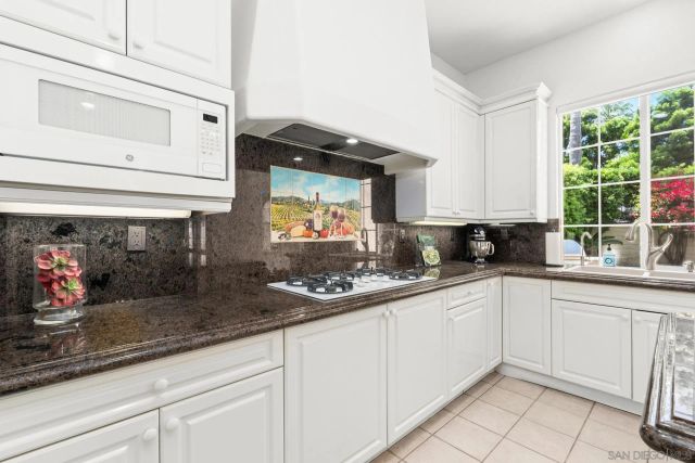 a view of a livingroom with furniture wooden floor and a window