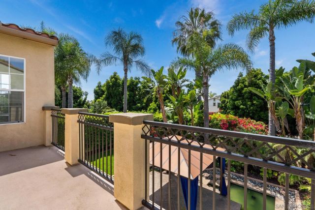 a view of a pathway with flower plants