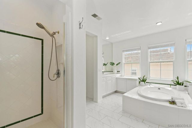 an aerial view of a city with lots of residential buildings ocean and ocean view