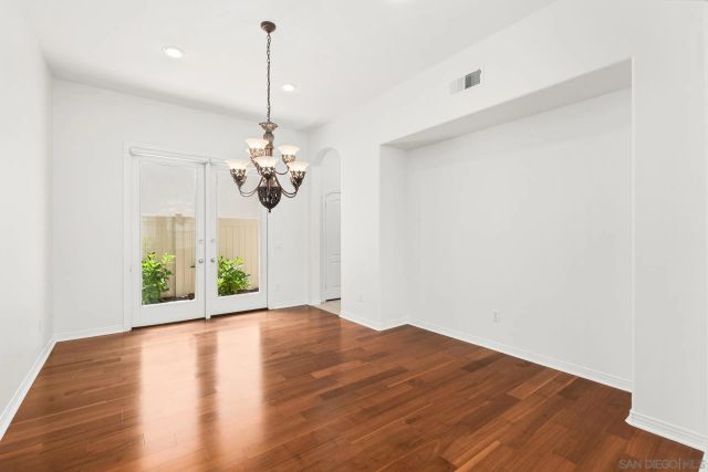 a large kitchen with kitchen island a large counter space and stainless steel appliances