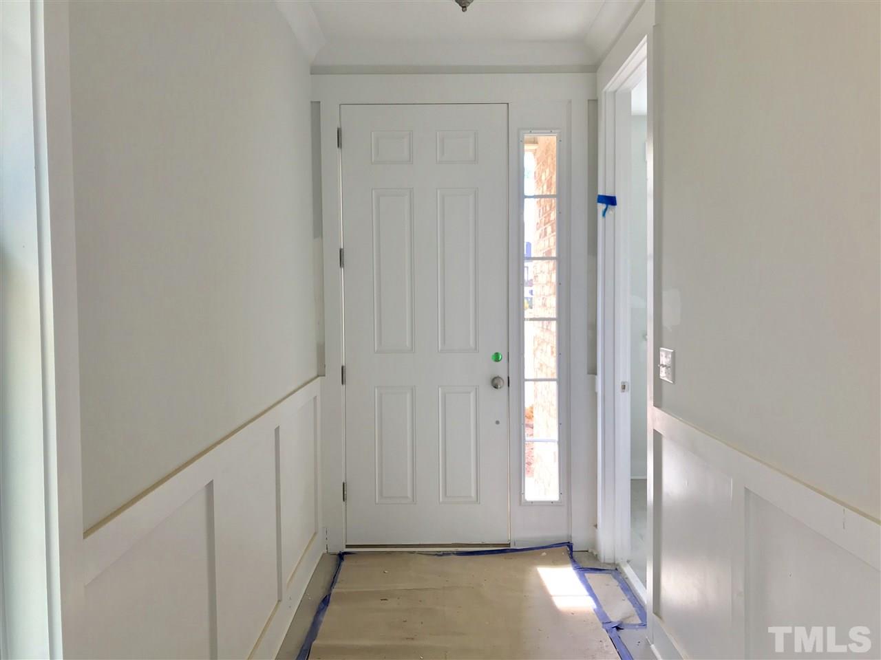 Craftsman wainscoting in the foyer.
