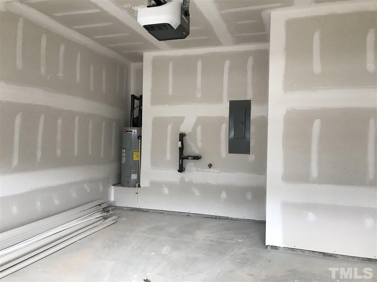 2516 Rambling Creek Road, Unit 28 Apex, NC 27523 - Photo 21 of 29 Garage with an extra 10.8x4.6 area for storage.