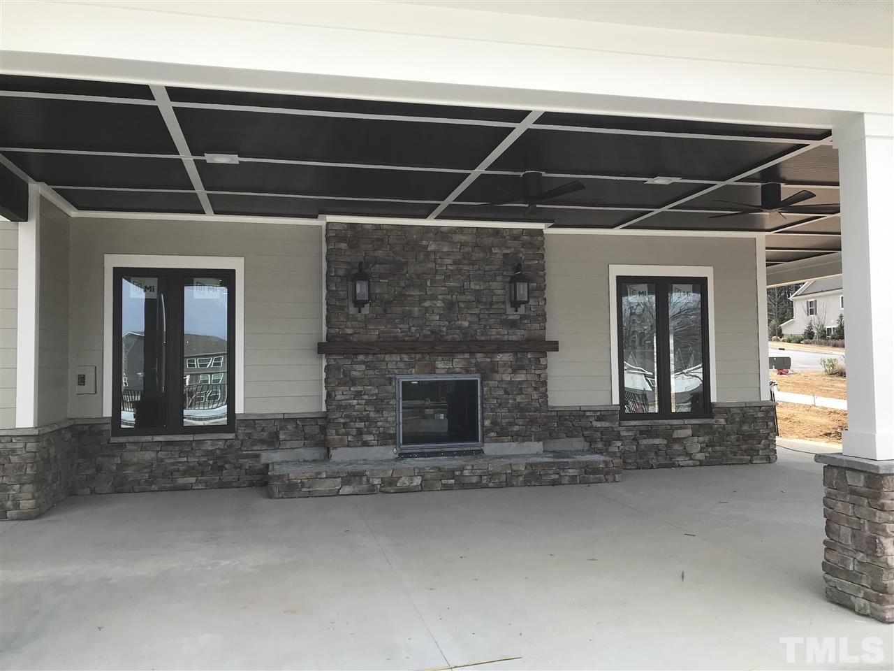 2516 Rambling Creek Road, Unit 28 Apex, NC 27523 - Photo 25 of 29 Outdoor covered area with a fire place.