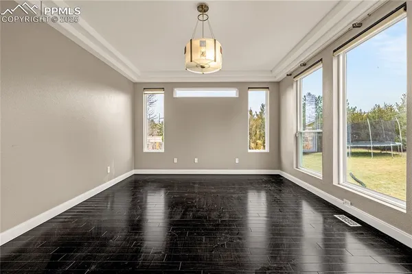 a view of an entryway with wooden floor