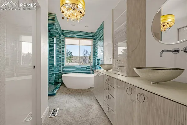 a very nice looking room with a large window and chandelier