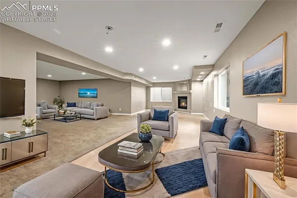 a living room with furniture and a flat screen tv