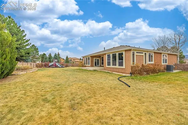 an aerial view of a house with outdoor space
