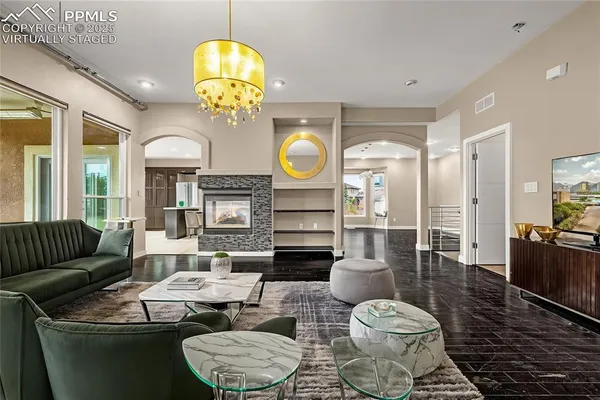 a living room with furniture and a fireplace