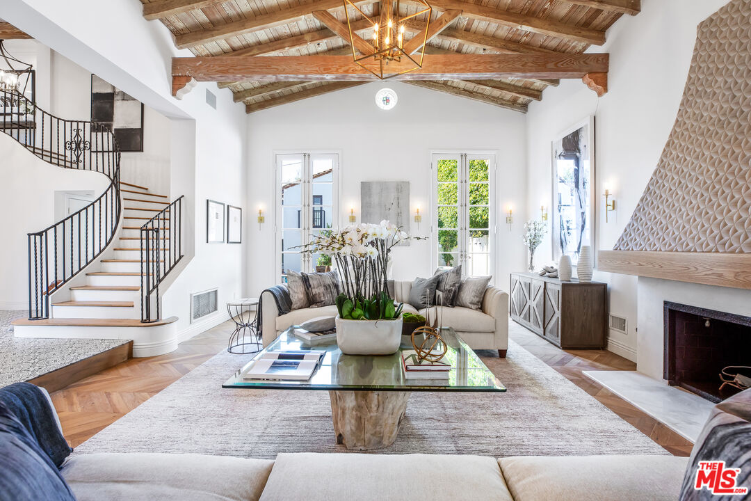 623 Walden Drive Beverly Hills, CA 90210 - Photo 3 of 28 a living room with furniture fireplace and a fireplace
