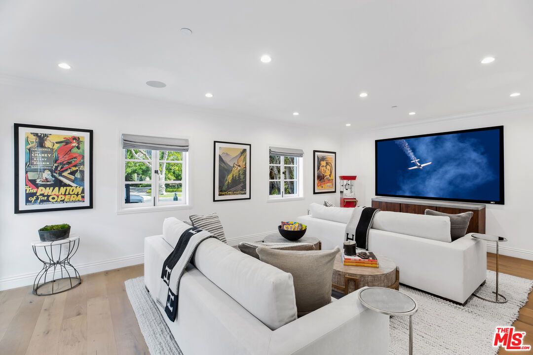 623 Walden Drive Beverly Hills, CA 90210 - Photo 23 of 28 a living room with furniture and a flat screen tv
