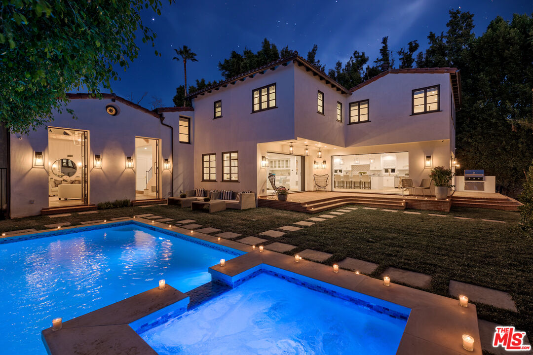 623 Walden Drive Beverly Hills, CA 90210 - Photo 25 of 28 a front view of a house with yard