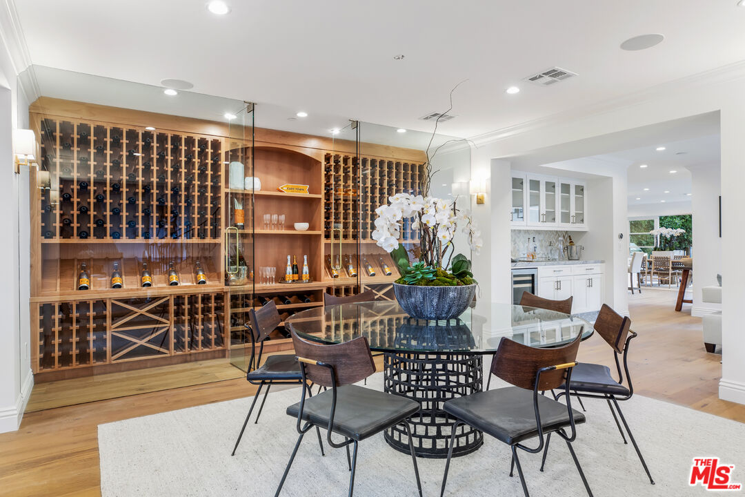 623 Walden Drive Beverly Hills, CA 90210 - Photo 8 of 28 a dining room with furniture and wooden floor
