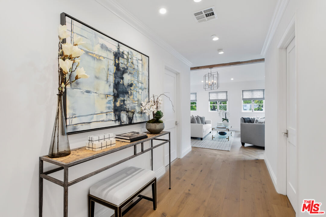 623 Walden Drive Beverly Hills, CA 90210 - Photo 9 of 28 a view of a hallway with living room