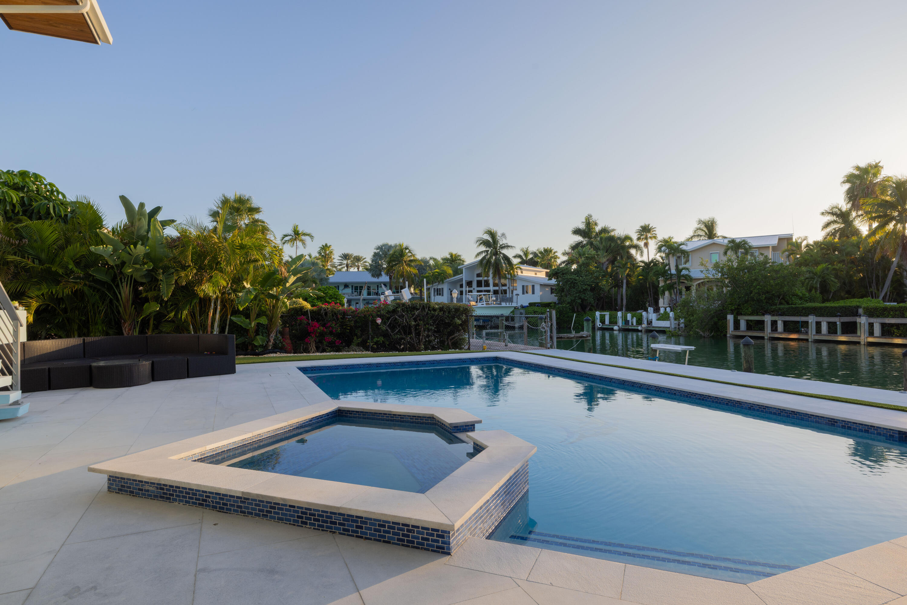 241 12th Street Key Colony Beach, FL 33051 - Photo 59 of 74 a view of swimming pool with seating space and trees in the background