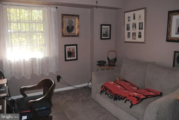 a bedroom with bed and a window