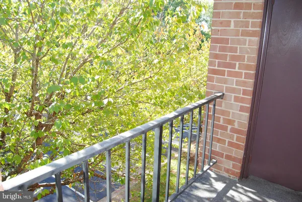 a view of balcony with wooden floor