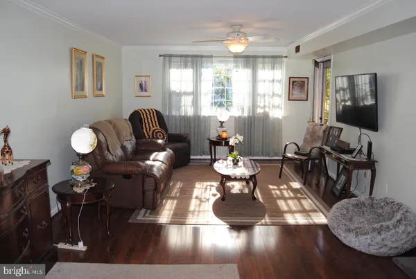 a living room with fireplace furniture and a flat screen tv