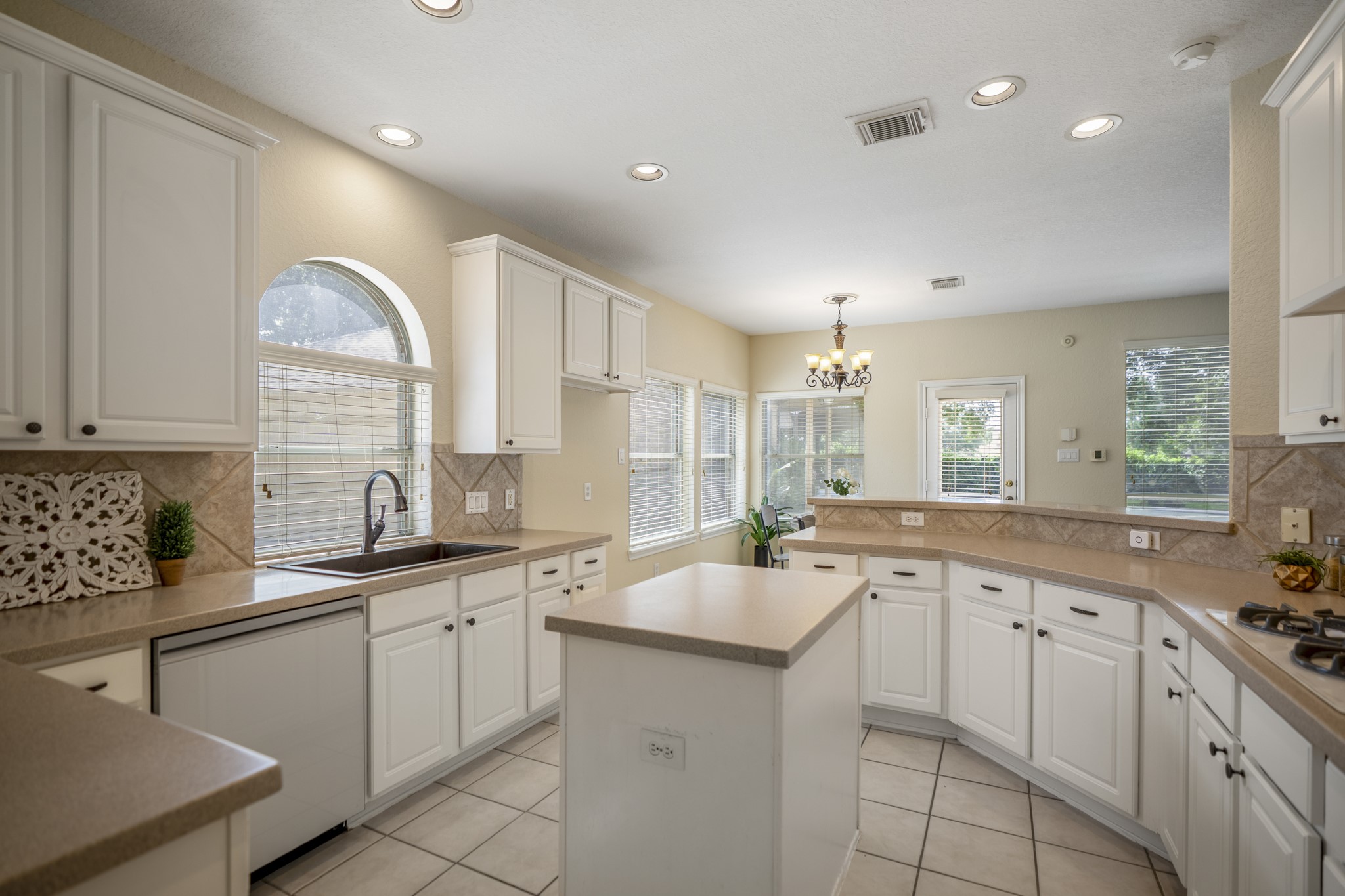 5807 Sequoia Trace Court Spring, TX 77379 - Photo 13 of 50 The kitchen keeps the main level connected, with a center island, abundant cabinetry, and a breakfast bar open to the living area so conversation can easily continue from meal prep to movie night.