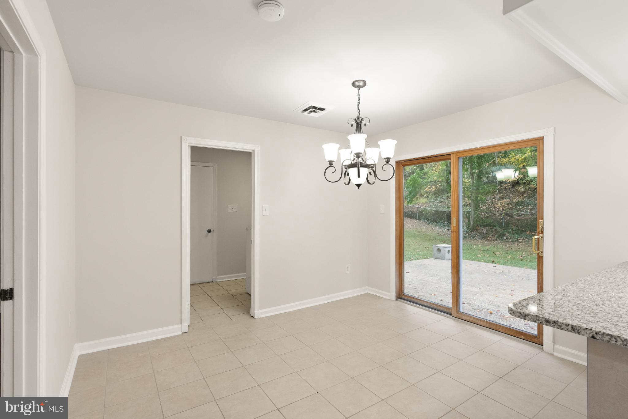 7075 Yates Ford Road Manassas, VA 20111 - Photo 18 of 54 Bright and airy dining space with outdoor view.