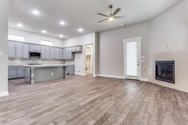 a view of kitchen with microwave and cabinets