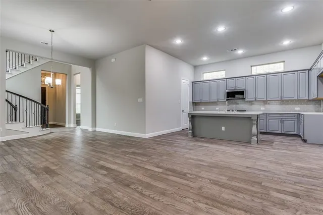 a view of kitchen with wooden floor