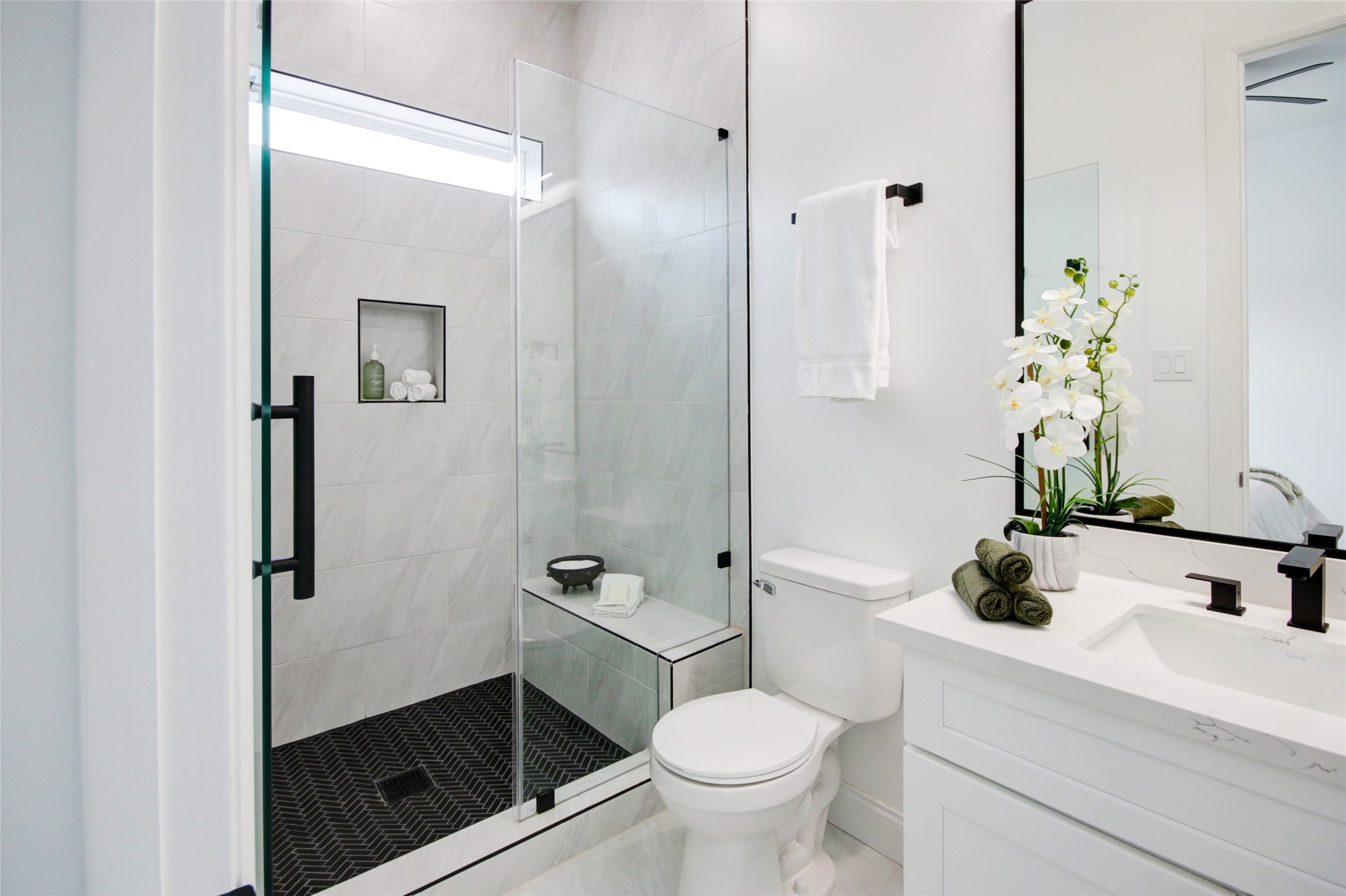 1214 West 24th Street, Unit D Houston, TX 77008 - Photo 32 of 45 a bathroom with a sink a toilet and shower