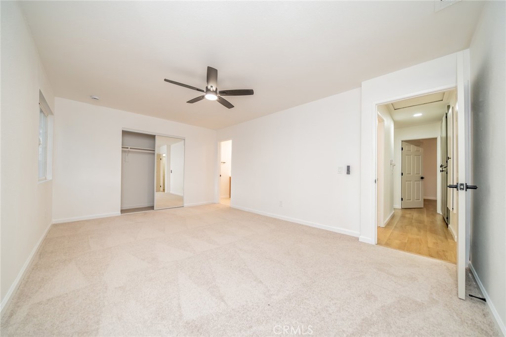 555 North Chestnut Avenue Rialto, CA 92376 - Photo 22 of 33 an empty room with fan and a ceiling fan