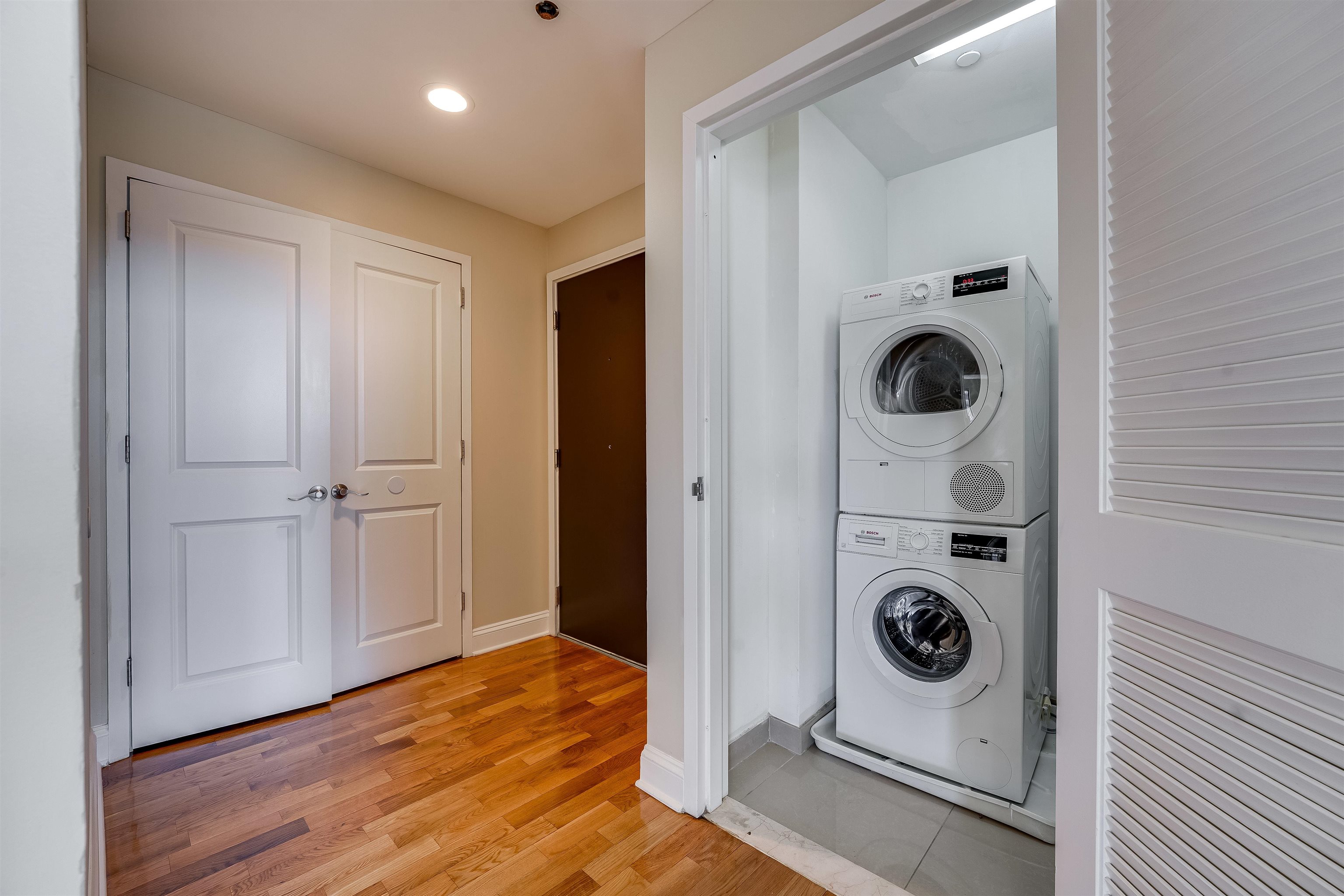 29 1st Street, Unit 401 Hackensack, NJ 07601 - Photo 13 of 23 a view of a storage & utility room with washer and dryer