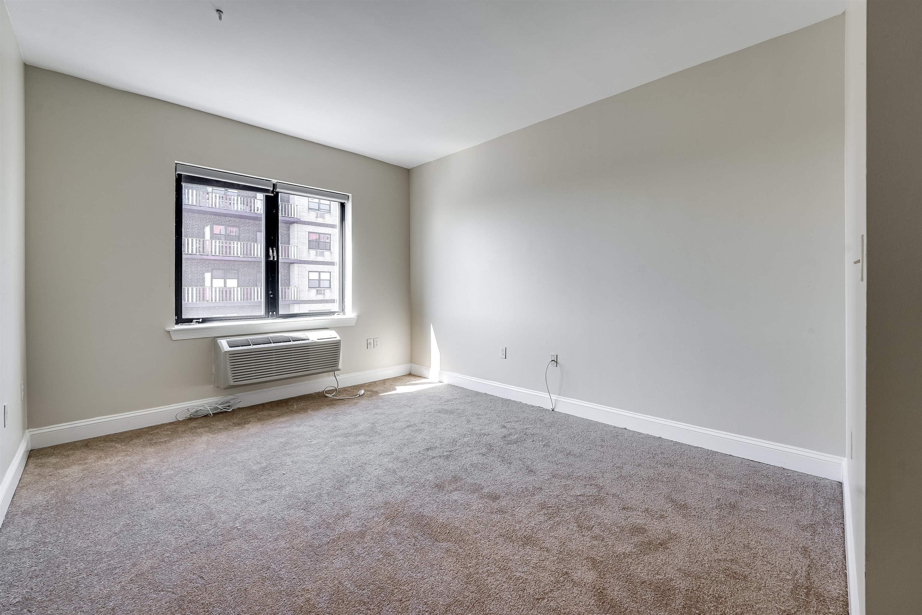 29 1st Street, Unit 401 Hackensack, NJ 07601 - Photo 9 of 23 an empty room with windows