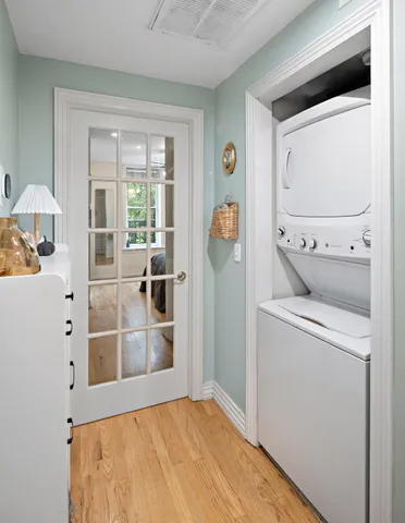 a view of a bedroom with washer and dryer